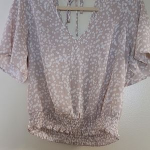 Crop top shirt, light beige and white specs.